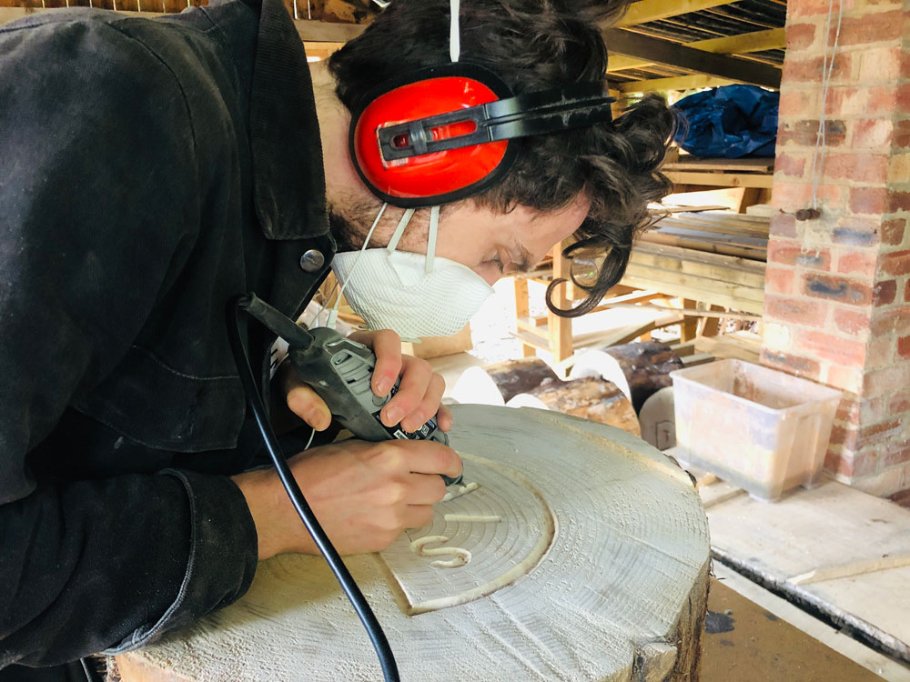 Sebastian Chaloner carving one of The Trail of Thought artworks